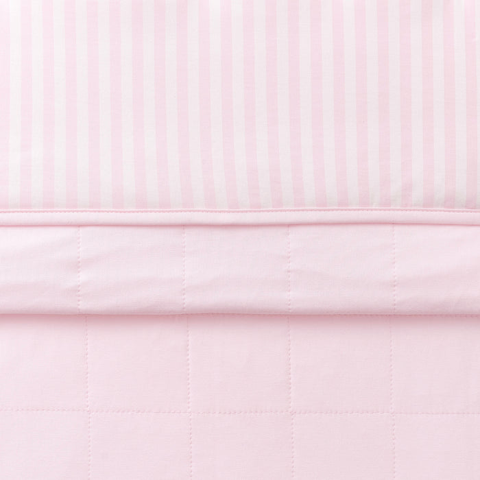 Toddler Blanket in Small Sakura Stripe 1.0 folded showing the quilted detail on the back of the blanket and the print detail on the front