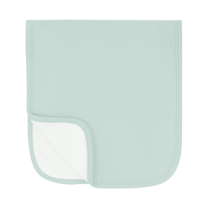 Burp Cloth in Sage folded in half with bottom corner folded upwards to show terry side