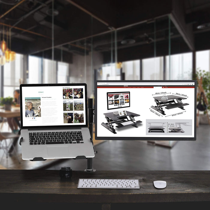 Duronic Laptop Attachment Stand holding a MacBook and screen over a wooden desk.