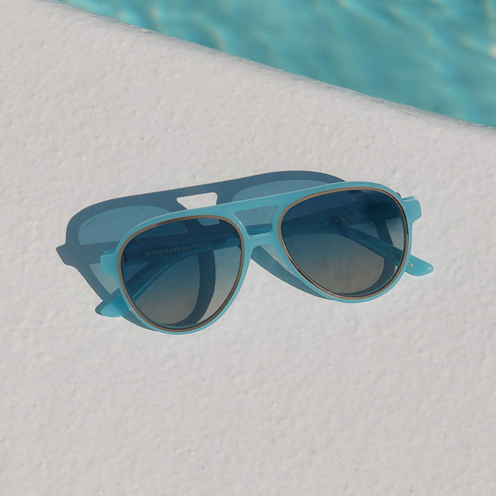 still life - iconica x diff eyewear pia oversized aviator sunglasses with a parasido blue acetate frame and paradiso blue polarized lenses