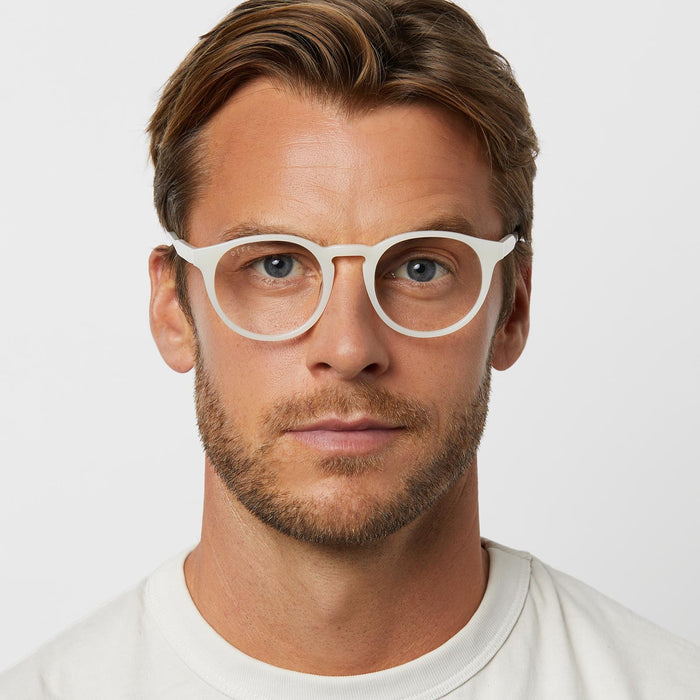 on model - male wearing diff eyewear featuring the sawyer round glasses with a meringue frame and prescription lenses front view