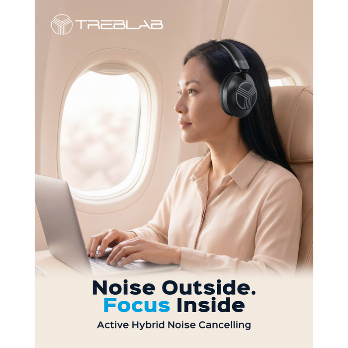 Woman wearing headphones using a laptop on an airplane with TREBLAB branding.
