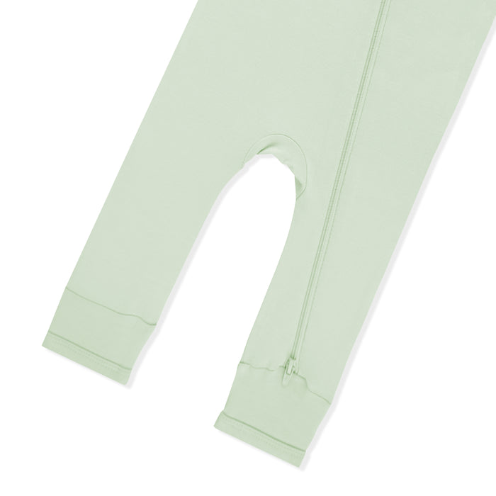 Zipper closure shown on the leg of the Zippered Romper in Basil