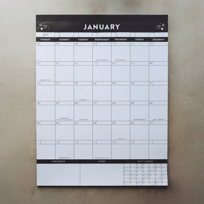 Black and white calendar on a light gray surface showing the month of January