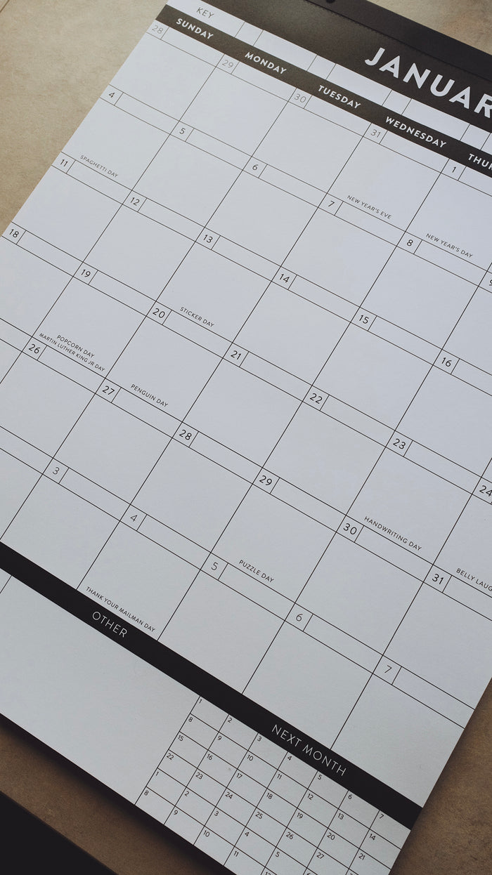 Calendar laying on a light gray surface showing the month of January