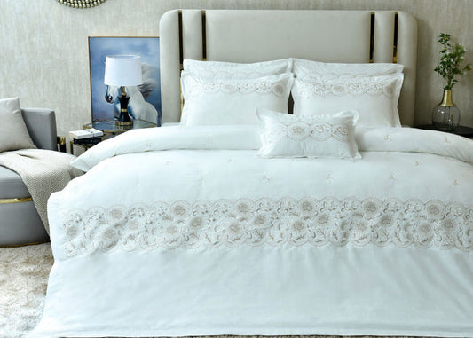 White queen duvet cover set with embroidered floral borders and matching pillow shams