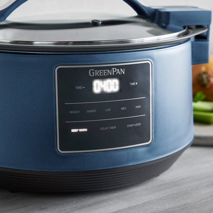 Blue GreenPan slow cooker with digital display on a wooden surface