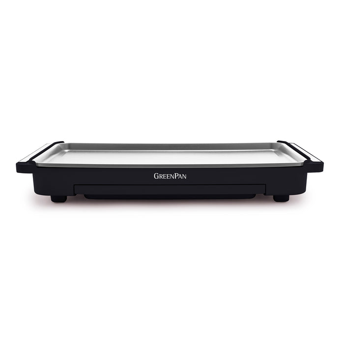 The Advanced Griddle with Warming Drawer | Graphite features a rectangular white nonstick cooking surface, black base, side handles, and "GreenPan" branding on the front.