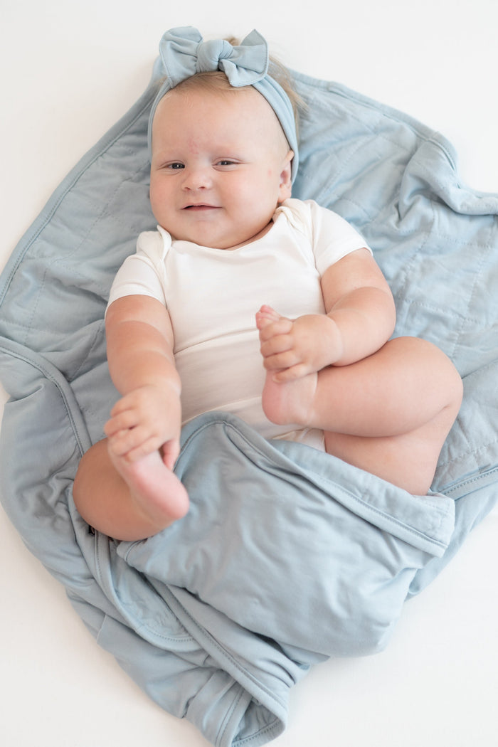 Baby in Cloud bodysuit laying on Baby Blanket in Fog 1.0