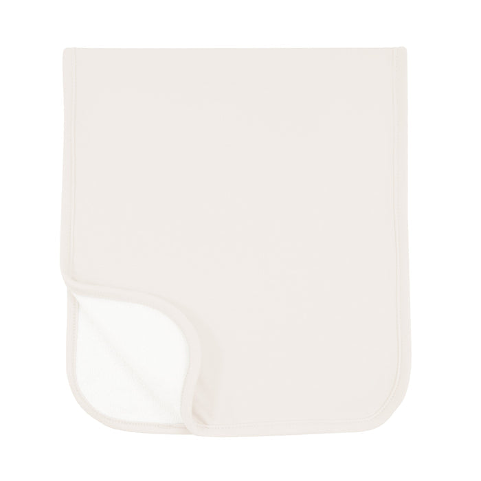 Burp Cloth in Oat folded in half with one corner folded showing terry side