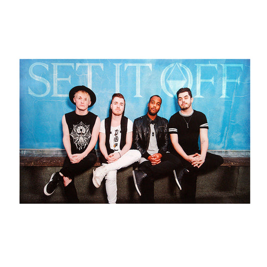 Horizontal Poster with 4 members of Set it off sitting on a wall. Above the wall is a blue background with the Set it Off Logo.