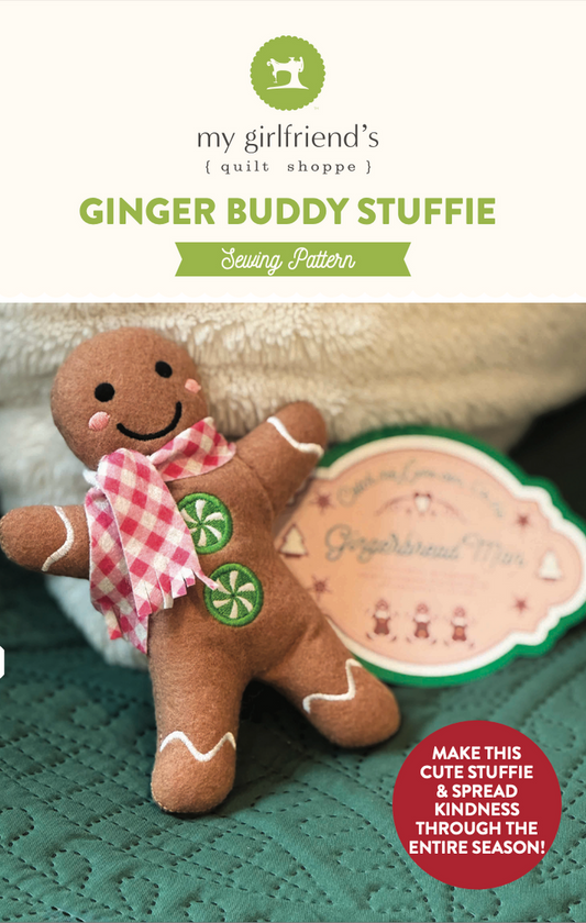 Gingerbread-themed stuffie with a sewing pattern label on a textured surface