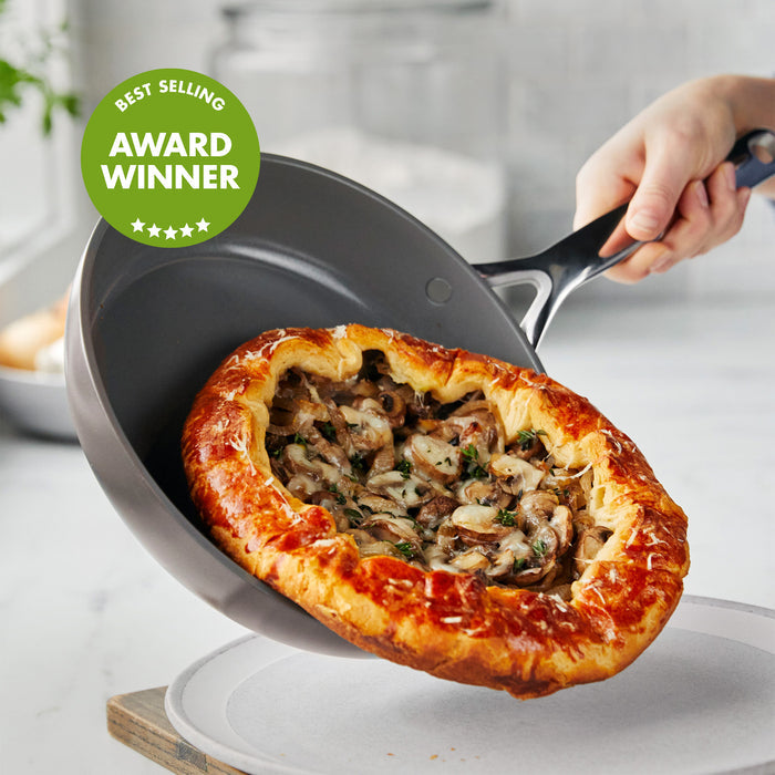 Baked mushroom galette being slid from a colorful ceramic nonstick frypan set, with a “Best Selling Award Winner” badge.