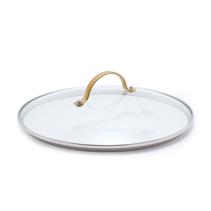 Tempered glass lid with matte gold handle, shown angled on a white background.