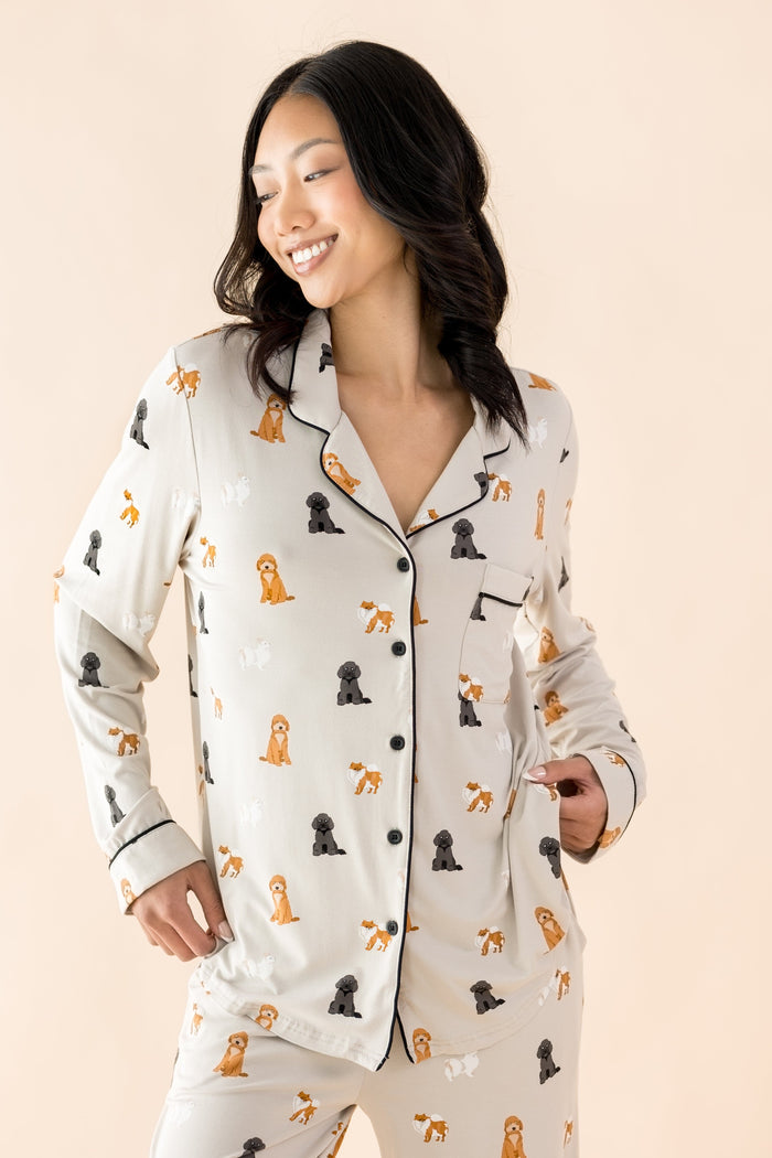 The shirt of the Long-Sleeved Women's Pajama Set in Fluffy Dog shown on a smiling female model