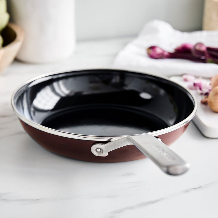 Chocolate Truffle enameled steel 9.5-inch frypan on a white countertop.