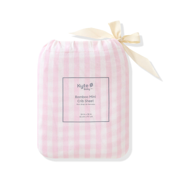 Mini Crib Sheet in Small Sakura Stripe shown in its packaging