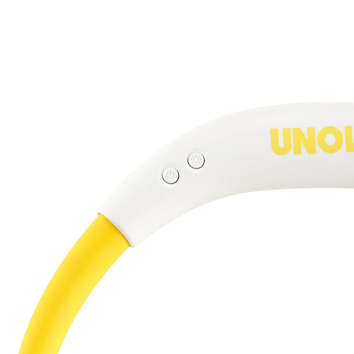 Nahaufnahme eines weiß-gelben NACKENVENTILATOR BREEZY von Unold mit zwei runden Knöpfen und teilweisem „UNOL“-Branding auf der gewölbten Oberfläche.