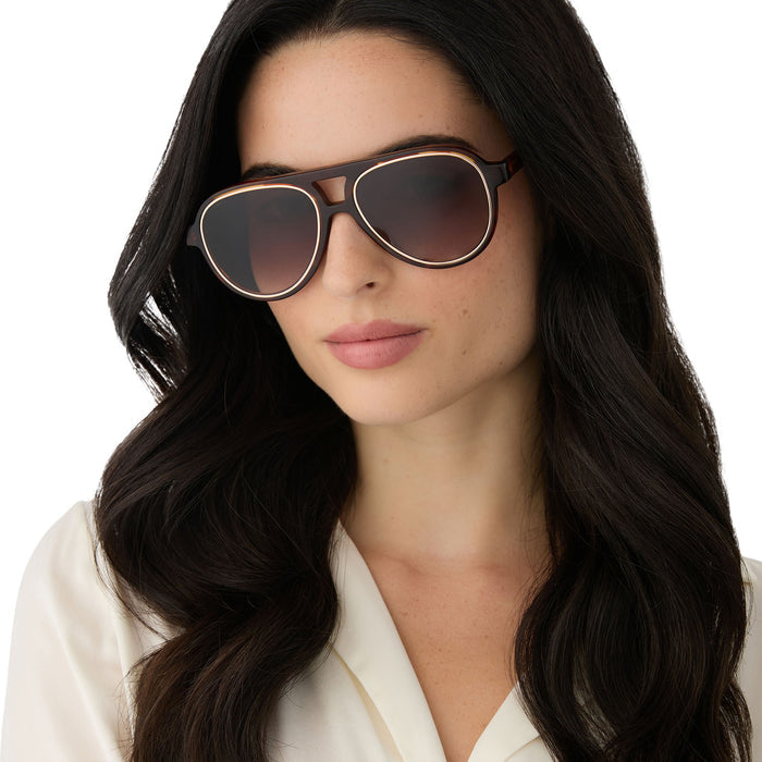 on model - female wearing iconica featuring the pia aviator sunglasses with a salted caramel tortoise frame and brown gradient polarized lenses front view