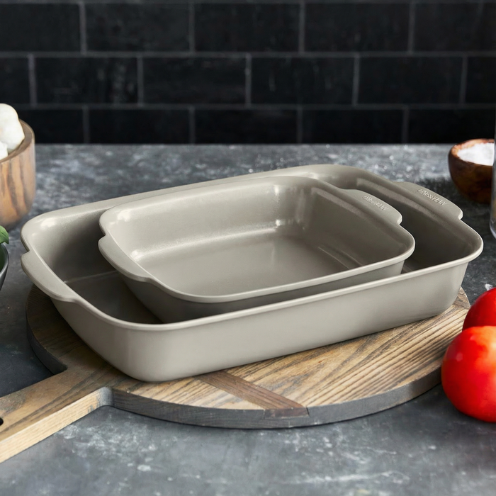 Two taupe ceramic nonstick cake pans, 2-piece set, shown nested together.