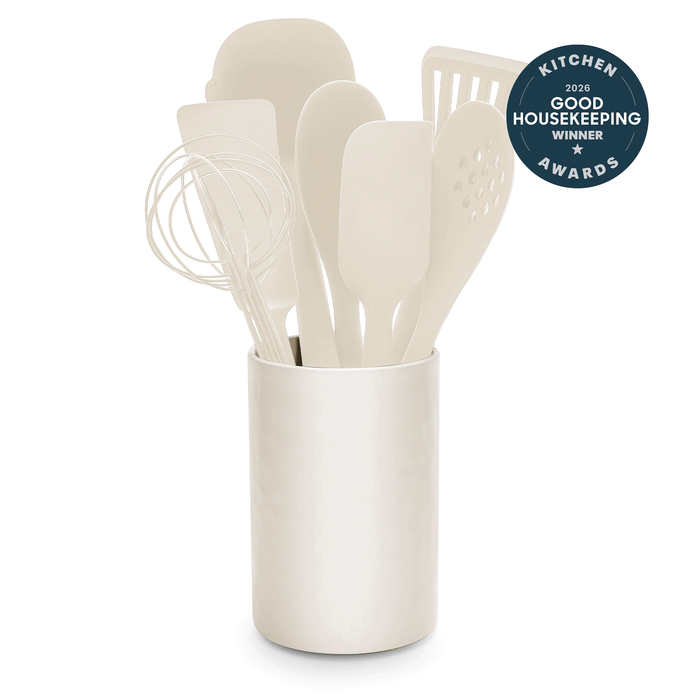 Silicone utensil set with crock in bisque color, includes 8 pieces displayed together.