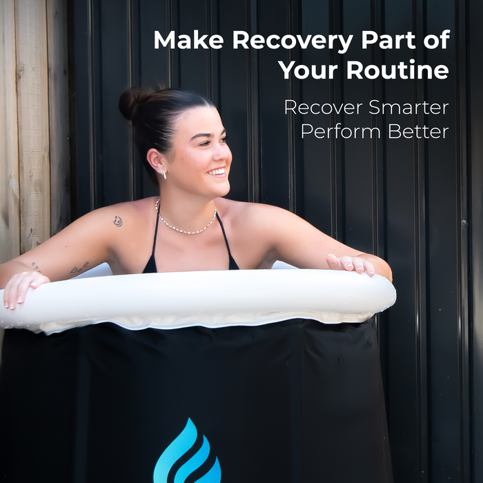 RECOVERO Ice Bath with a smiling woman leaning on the white inflatable rim against a dark wall