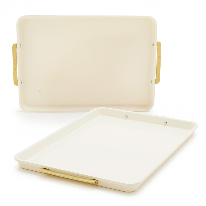 Two cream half sheet pans with gold-tone handles, 2-piece set, displayed upright and flat on a white background.