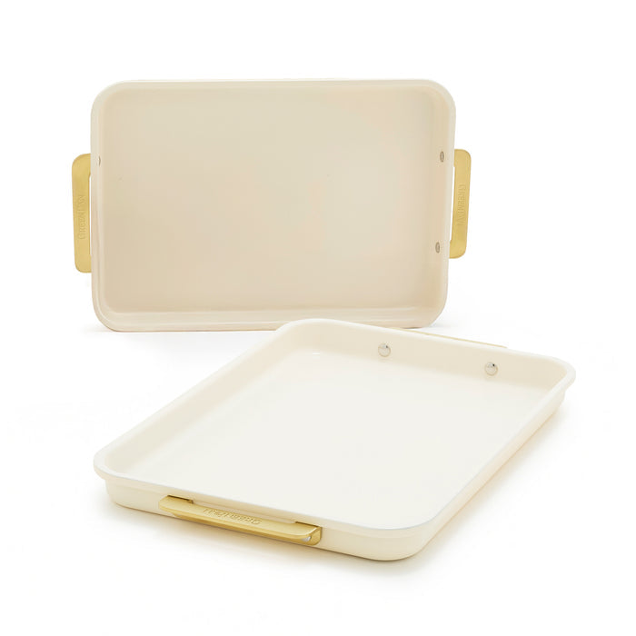 Two cream-colored sheet pans with gold handles, shown as a 2-piece bakeware set.
