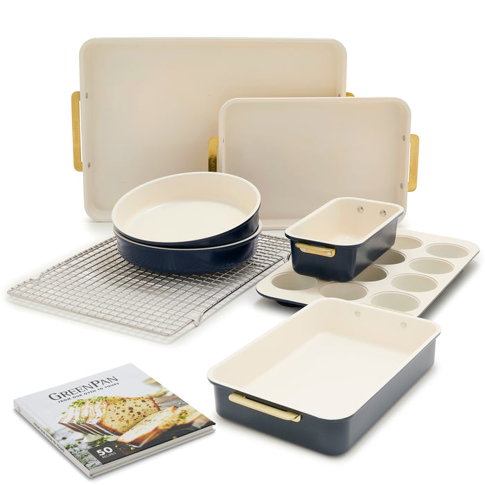 8-piece bakeware set in blue and white with gold handles, cooling rack, and recipe booklet included.