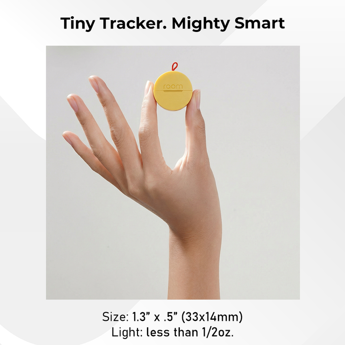 Yellow Roam smart tracker held on fingertip showing tiny size of 1.3 x 0.5 inch 33x14mm and weighing less than half an ounce - Tiny Tracker Mighty Smart
