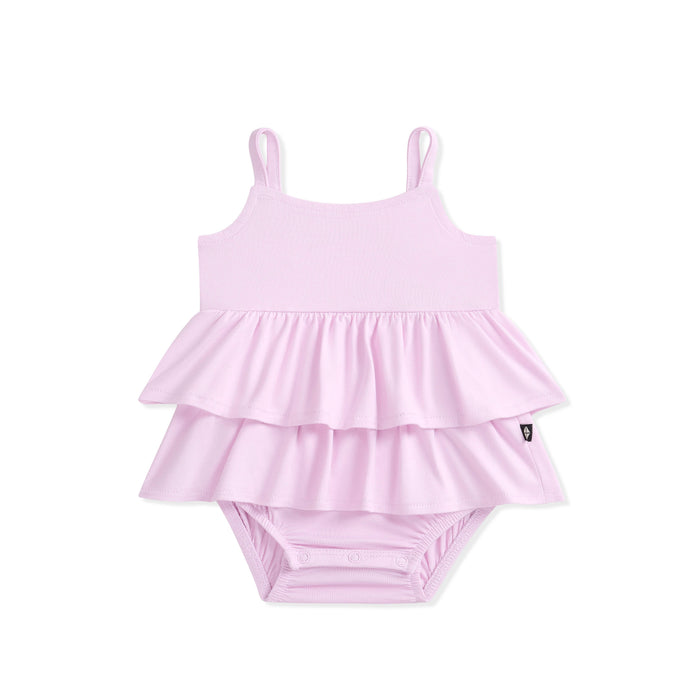 Purple baby bodysuit dress with ruffled layers on a white background