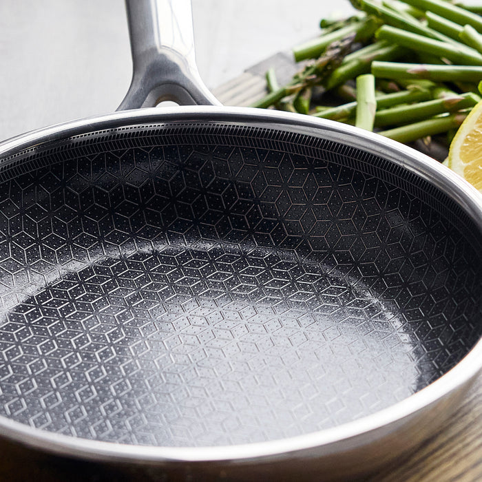 Spectra Thermobond Hybrid Ceramic 8-inch frypan with speckled finish, asparagus and lemon in background.