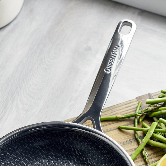 Hybrid ceramic nonstick 8-inch frypan on a counter next to a board with chopped green beans and asparagus.
