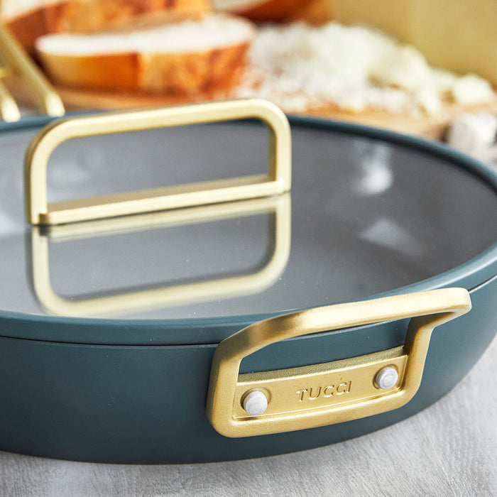 Venetian teal ceramic frypan with gold handles and glass lid, 12-inch size shown close-up.