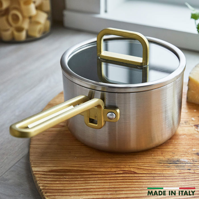 Stainless steel 2-quart nonstick saucepan with lid, champagne handle, engraved with MADE IN ITALY.