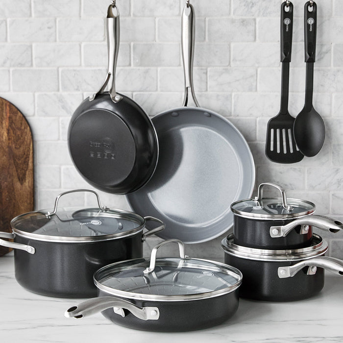 12-piece ceramic cookware set with glass lids, gray finish, hanging utensils, and skillet included.