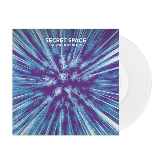 The album cover for Secret Space’s The Window Room showcases blue and purple abstract lines radiating outward. Part of a limited pressing, a clear vinyl record from Secret Space is partially visible behind the cover.