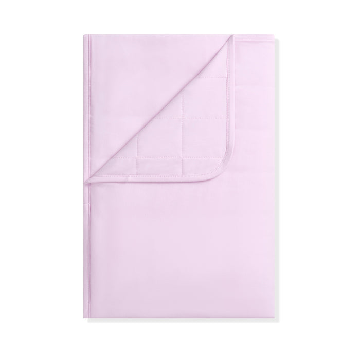 Folded light purple blanket on a white background