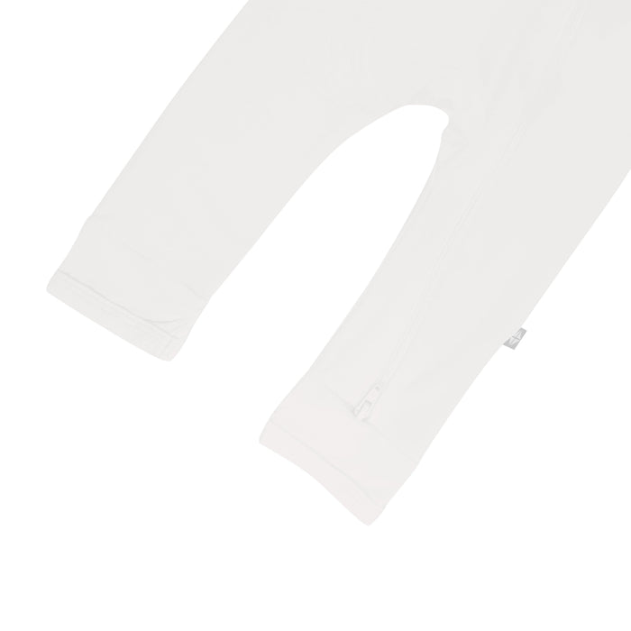 Close up of open feet on Kyte Baby Zippered Romper in Cloud