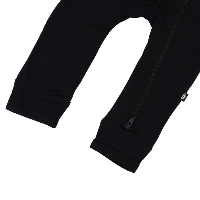 Open feet and bottom zipper on Kyte Baby Zippered Romper in Midnight