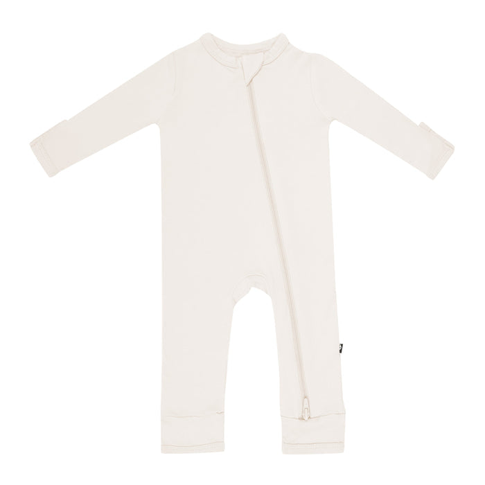 Flat lay of Kyte Baby Zippered Romper in Oat