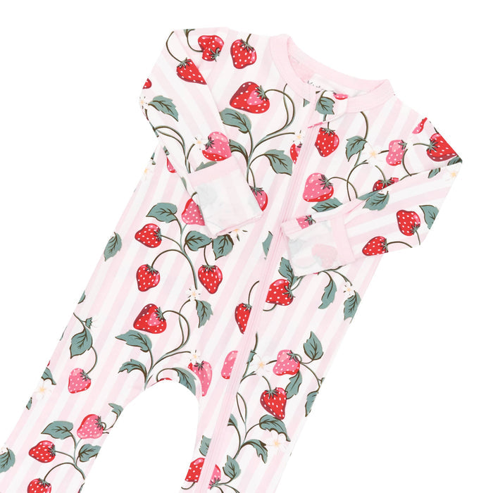 Close up zipper garage and fold over hand cuffs shown on the Zippered Romper in Strawberry Fields
