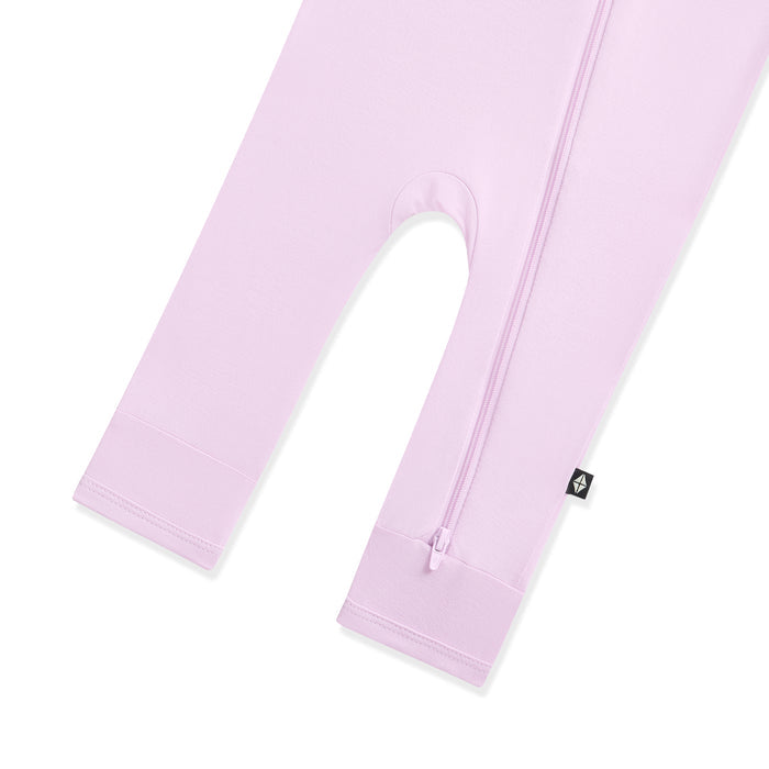 Light purple baby romper with a zipper on a white background